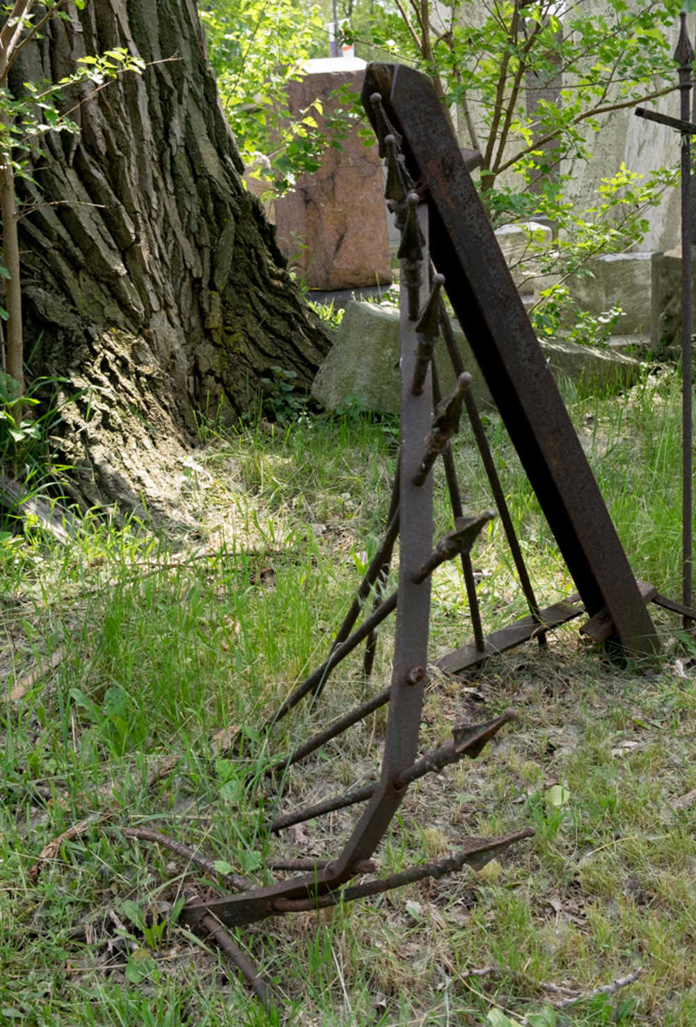 rusted, bent fence falling into the ground